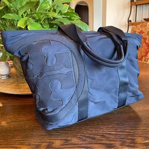 Authentic Tory Burch navy, nylon, zip tote with XL logo.